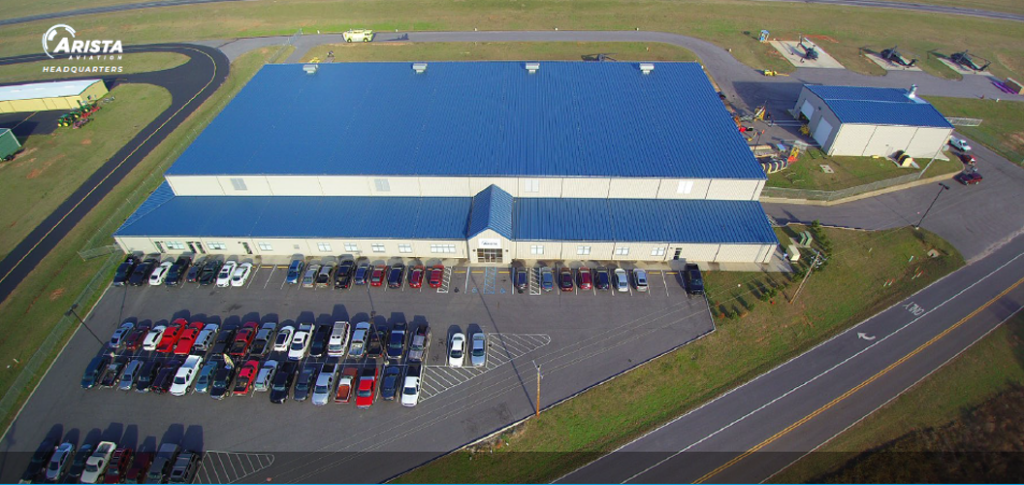 image of warehouse and parking area aerial view