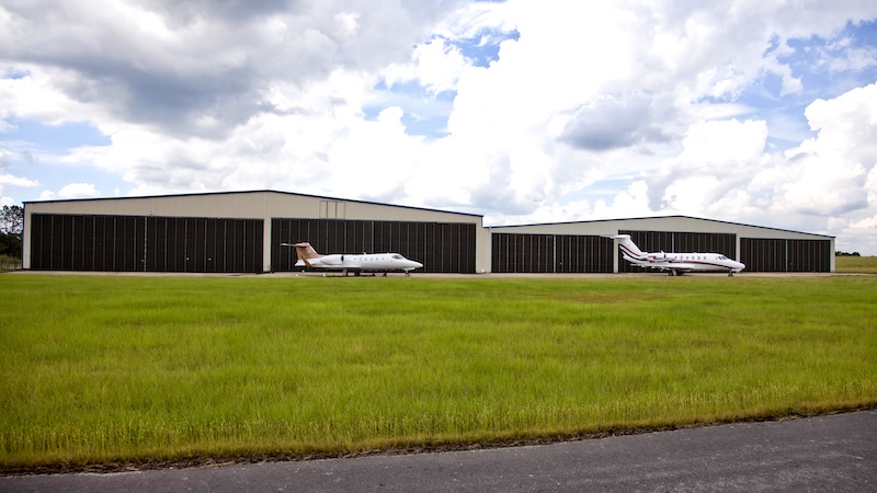 airplane in front of an air hanger